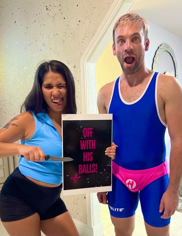 A bachelorette guest holds a playful Off With His Balls sign beside Jesse
