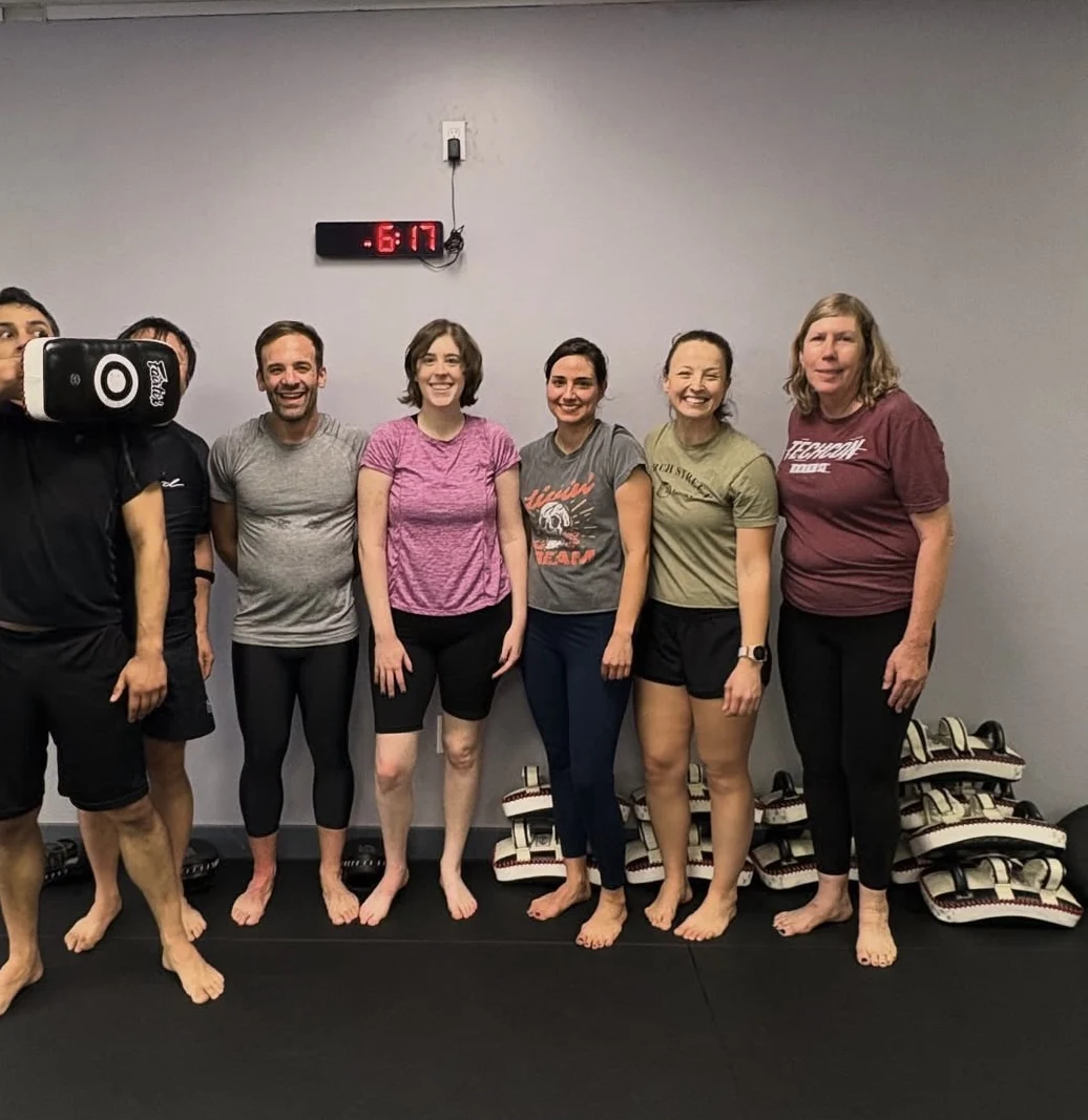 A smiling group after a Kick His Dick self-defense session