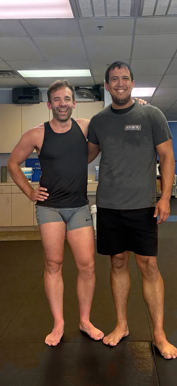 Jesse with a self-defense training instructor after class