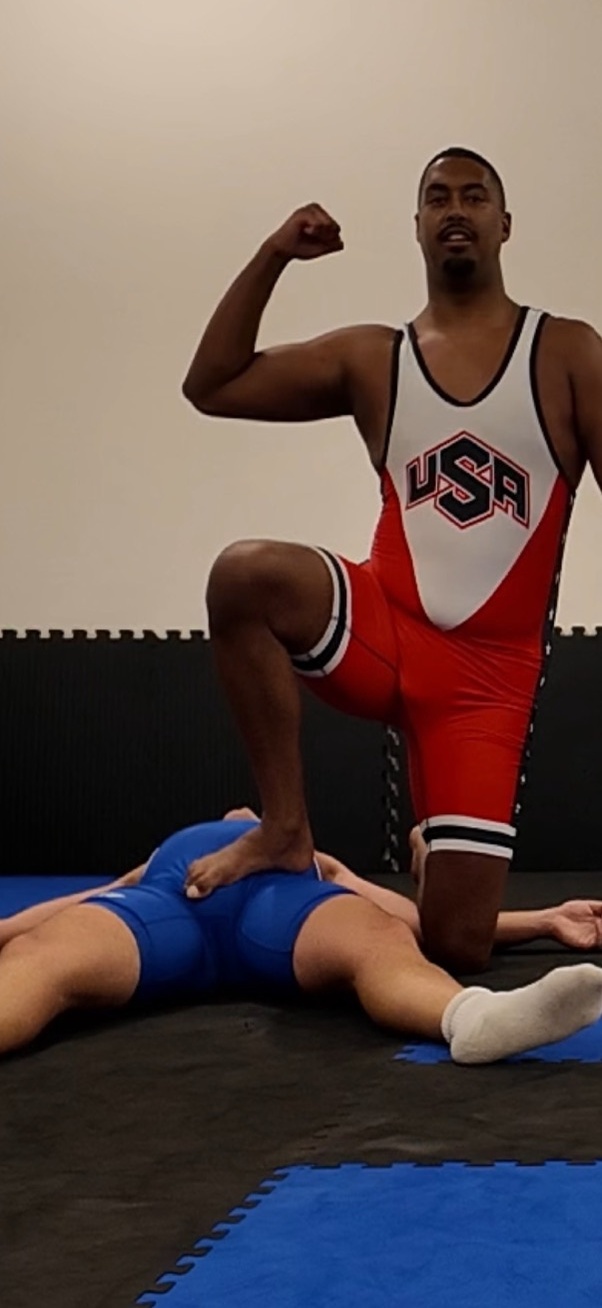 Michael flexing over Jesse after winning their wrestling match